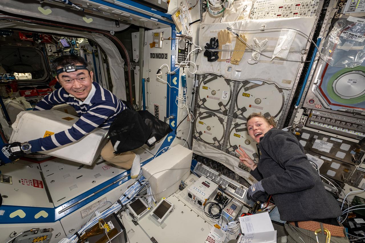 iss073e0545175 (Aug. 25, 2025) --- Expedition 73 Flight Engineers Kimiya Yui of JAXA (Japan Aerospace Exploration Agency) and Zena Cardman of NASA unpack some of the science, supplies, and hardware delivered aboard the SpaceX Dragon cargo spacecraft and begin installing the new gear inside the International Space Station.