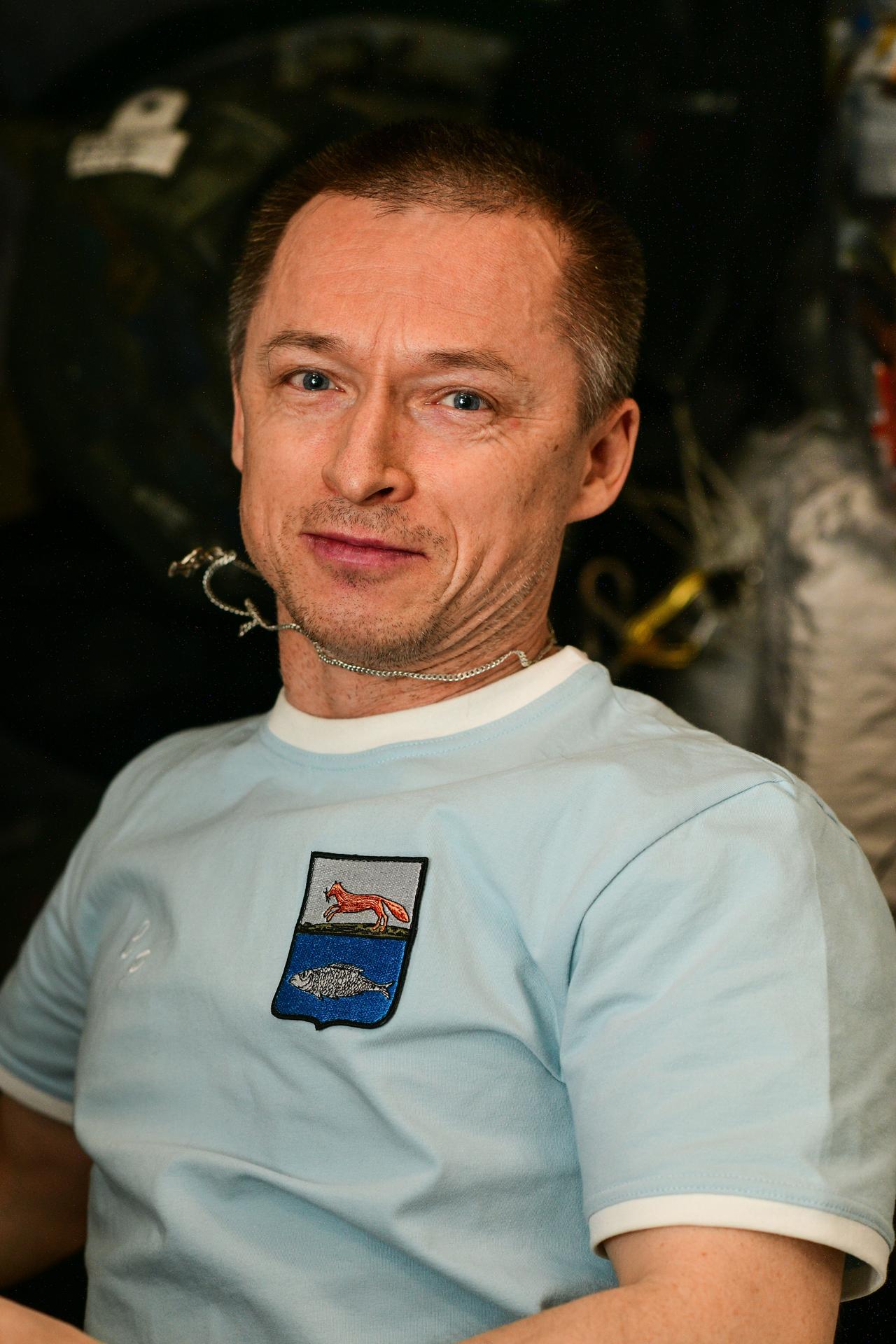 Roscosmos cosmonaut and Expedition 73 Commander Sergey Ryzhikov is pictured during electronics maintenance at the beginning of his shift aboard the International Space Station.