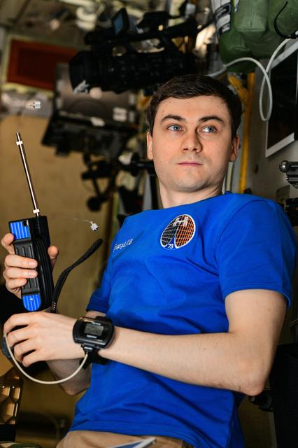 NASA image: Roscosmos cosmonaut Alexey Zubritsky is pictured with an air sampling device