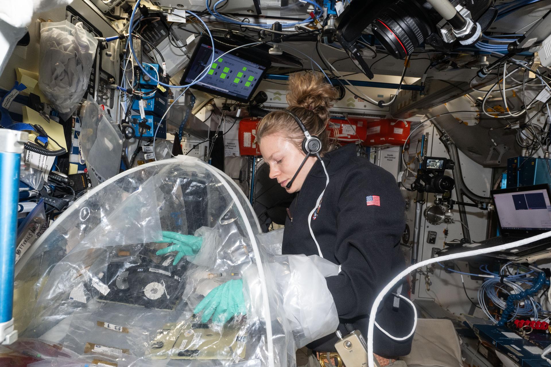NASA astronaut and Expedition 73 Flight Engineer Zena Cardman treats bioprinted liver tissues in a portable glovebag inside the International Space Station's Harmony module. The samples will be placed inside an artificial gravity-generating research device to help researchers understand how microgravity affects the formation of blood vessels in engineered tissues. Result may lead to advanced treatments protecting astronauts on long-duration spaceflights and improve bioprinting techniques for patient therapies on Earth.