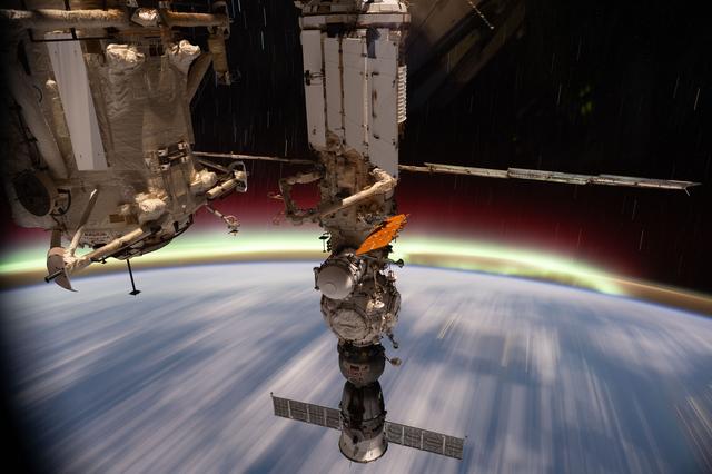 NASA image: The aurora australis streams above Earth's horizon