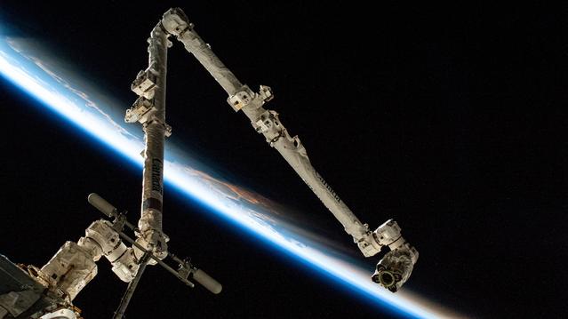 NASA image: The 57.7-foot-long Canadarm2 robotic arm extends from a grapple fixture