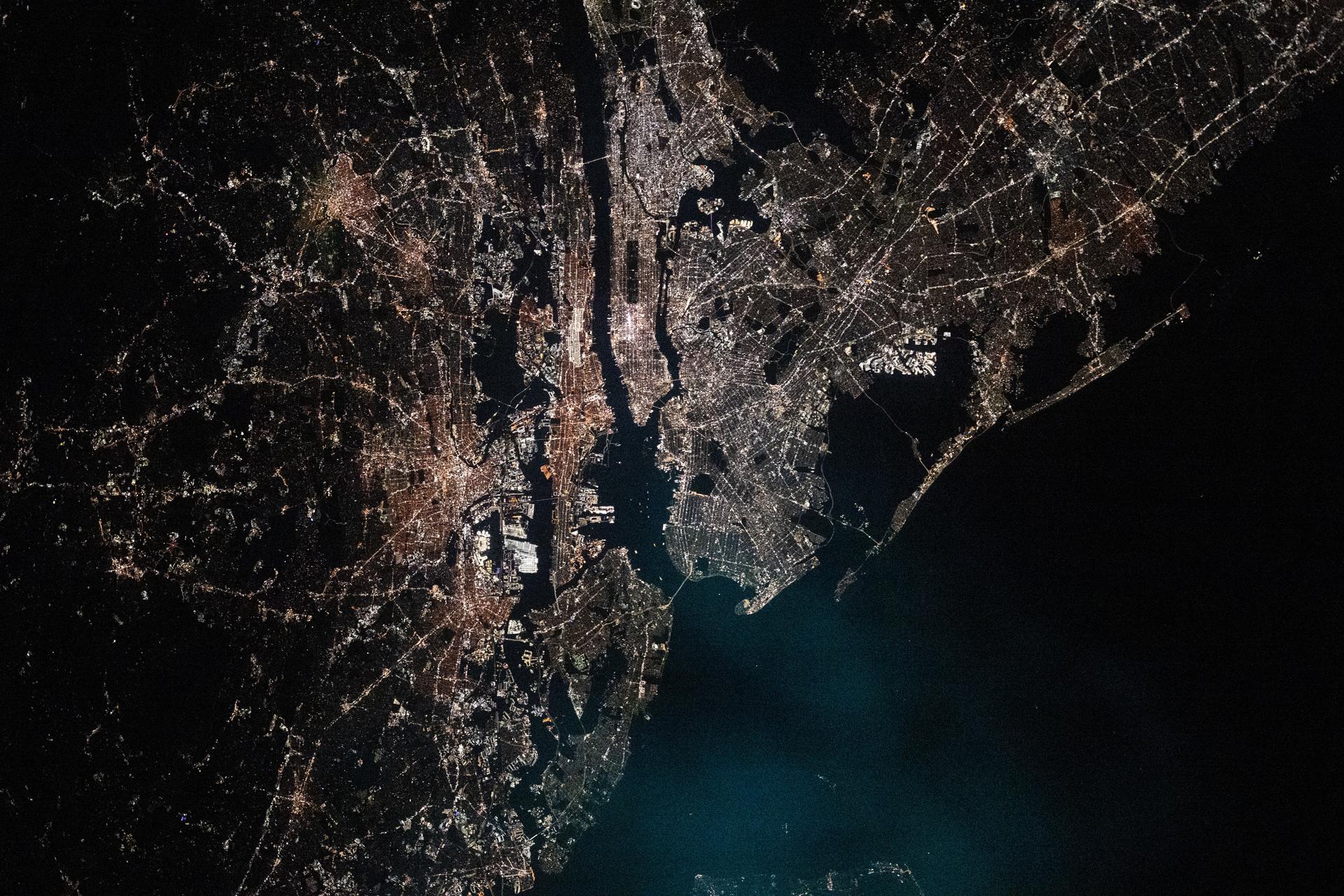 The New York-New Jersey metropolitan area, with a population of about 19.8 million, on the U.S. east coast is photographed at approximately 2:43 a.m. local time from the International Space Station as it orbited 262 miles above the Atlantic Ocean. The dark, rectangular shape near top center is Central Park in New York's borough of Manhattan.
