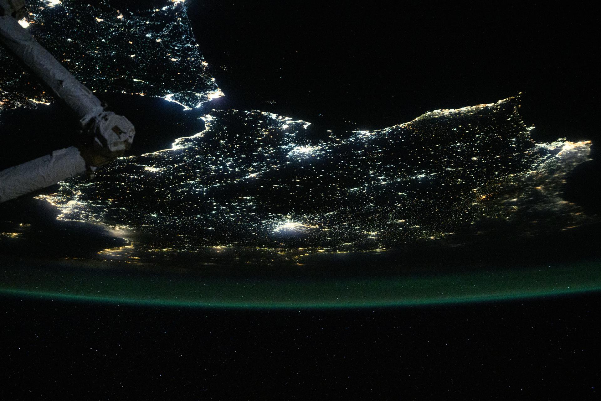 The nighttime coastal lights of Morocco and Spain, where the Atlantic Ocean meets the Mediterranean Sea at the Strait of Gibraltar, are pictured at approximately 1:36 a.m. local time as the International Space Station orbited 260 miles above the Moroccan coast.