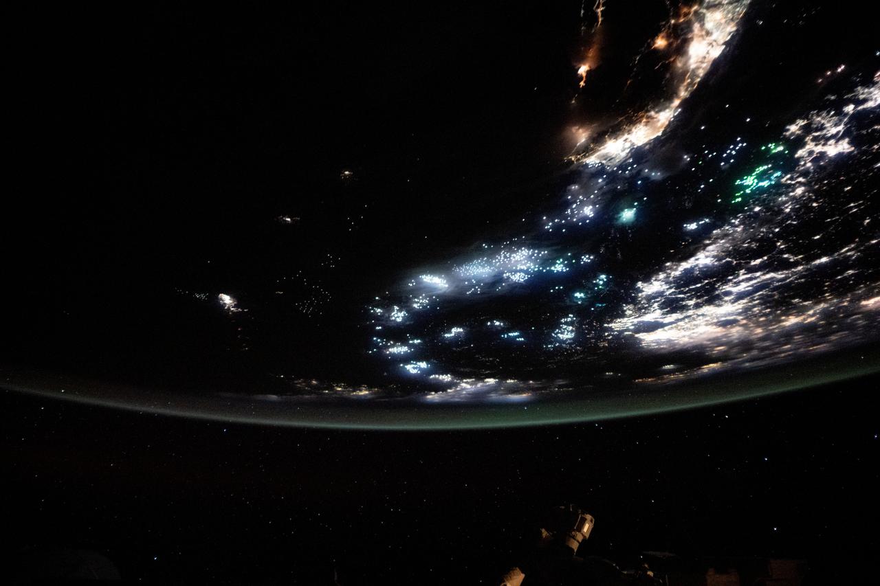 iss073e0688699 (Aug. 26, 2025) --- The blue-green lights of fishing boats, designed to lure squid, sardines, or mackerel, dot the East China Sea and the Taiwan Strait contrasting with the coastal city lights of Taiwan and China. The International Space Station was orbiting 259 miles above the South China Sea just south of Taiwan at approximately 11:53 p.m. local time when this photograph was taken.