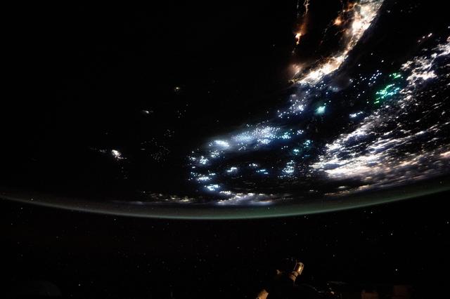 NASA image: The blue-green lights of fishing boats dot the East China Sea and the Taiwan Strait