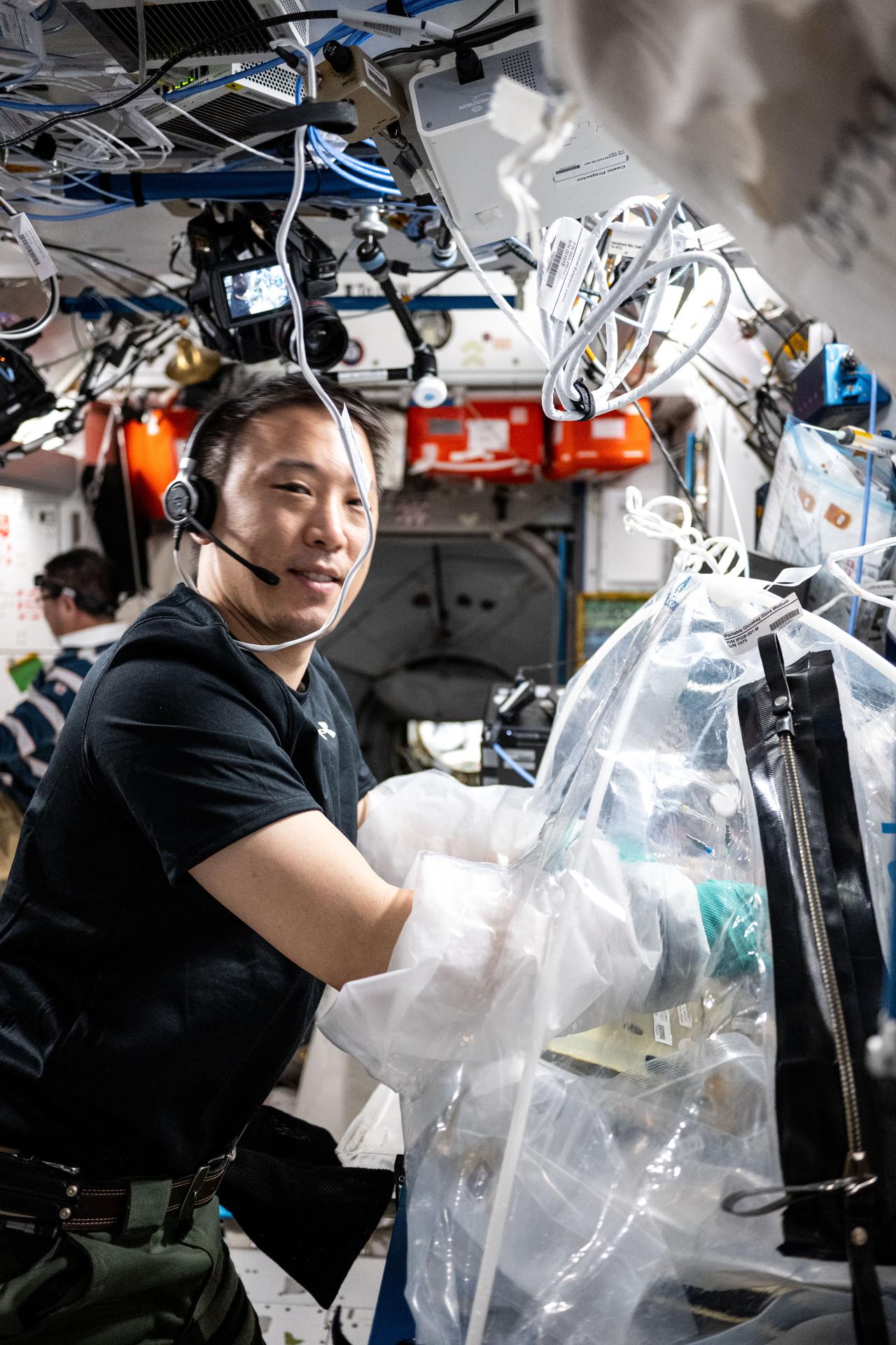 NASA astronaut and Expedition 73 Flight Engineer Jonny Kim treats bioprinted liver tissues in a portable glovebag inside the International Space Station's Harmony module. The samples were later placed inside an artificial gravity-generating research device to help researchers understand how microgravity affects the formation of blood vessels in engineered tissues. Result may lead to advanced treatments protecting astronauts on long-duration spaceflights and improve bioprinting techniques for patient therapies on Earth.