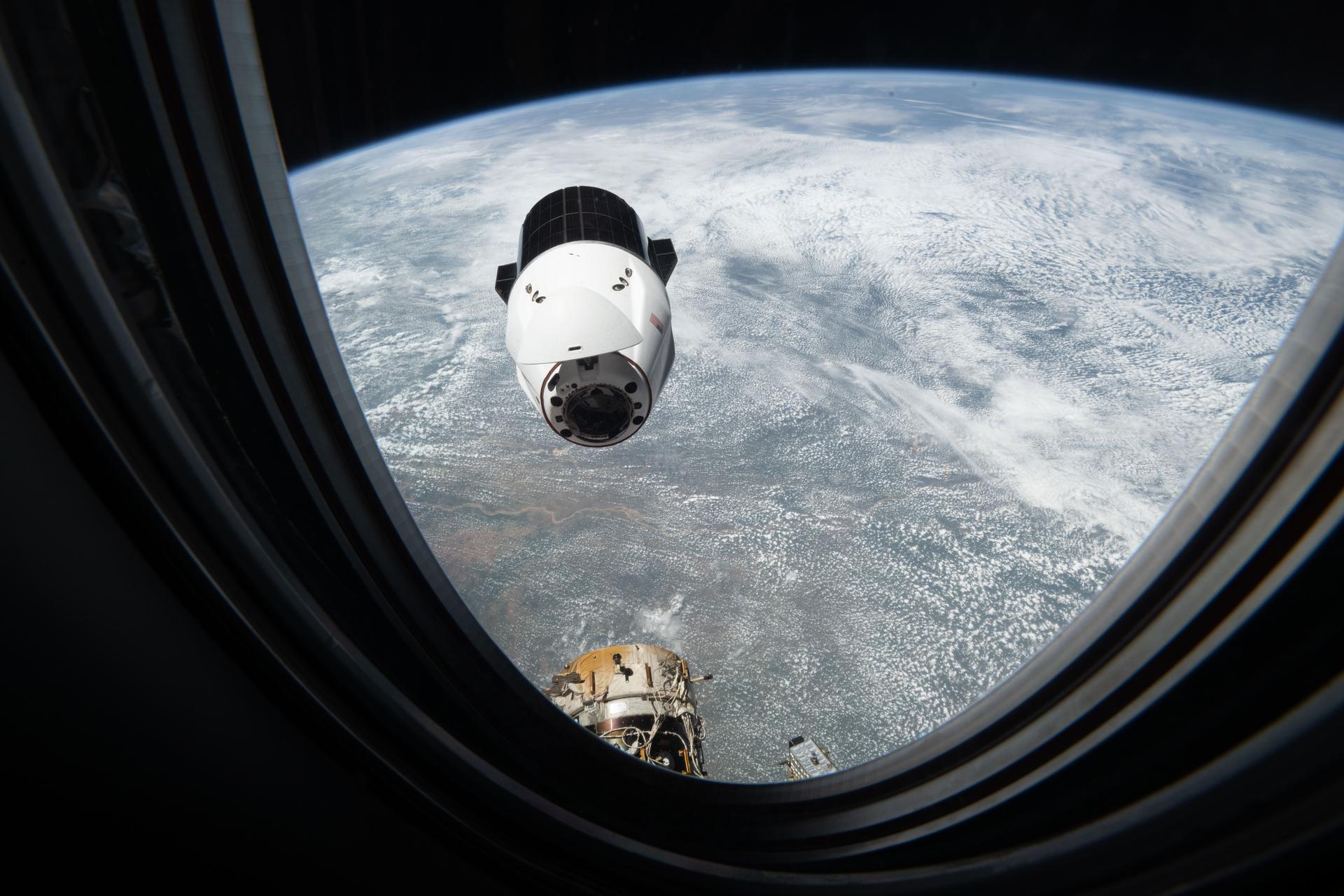 A SpaceX Dragon cargo spacecraft approaches the International Space Station's forward port on the Harmoy module as both spacecraft orbited 259 miles above the African nation of Mali.