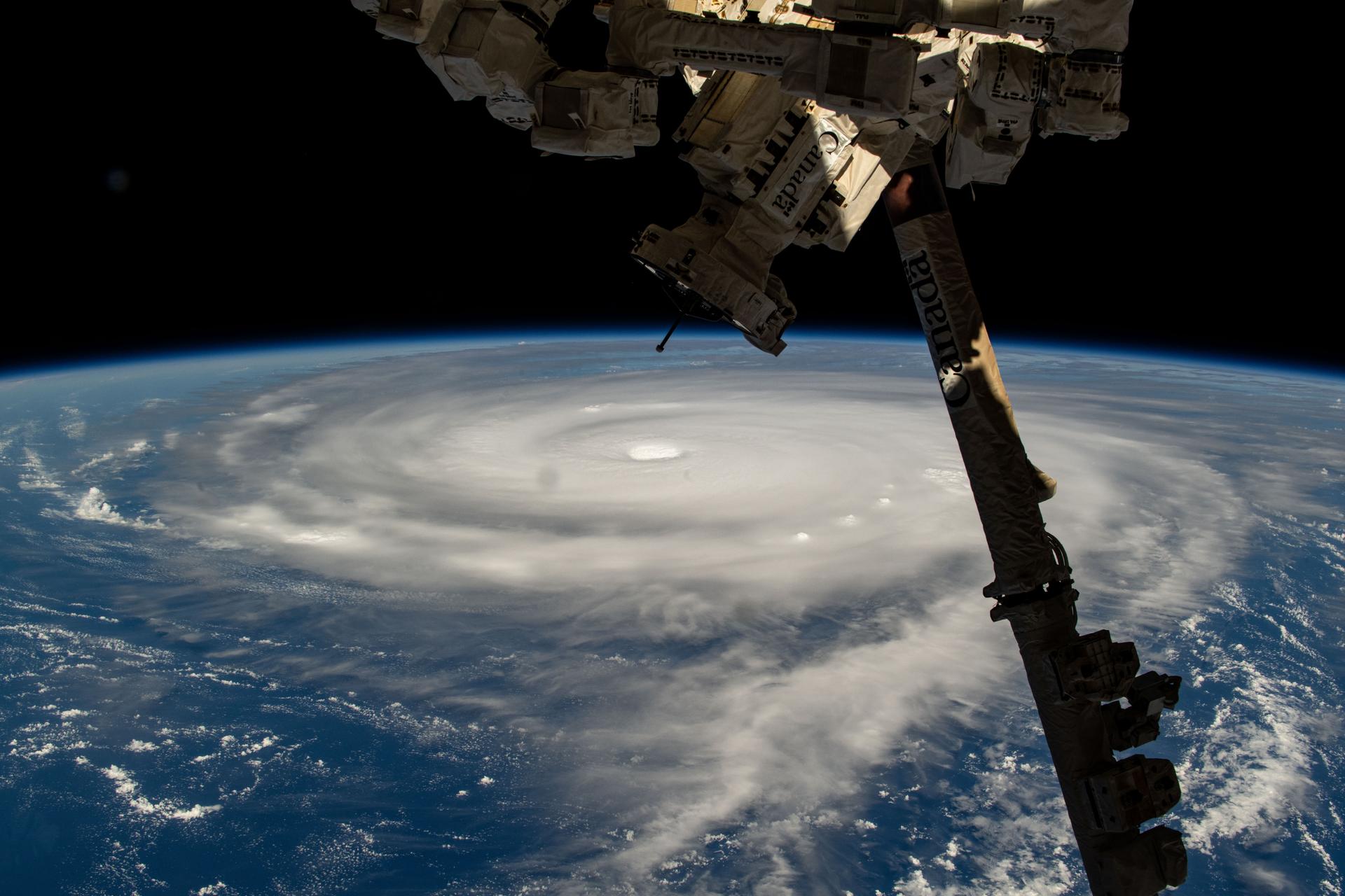Typhoon Neoguri is pictured in the Pacific Ocean from the International Space Station as it orbited 257 miles above. In the right foreground, is a portion of the Canadarm2 robotic arm with Dextre, its fine-tuned robotic hand, attached.