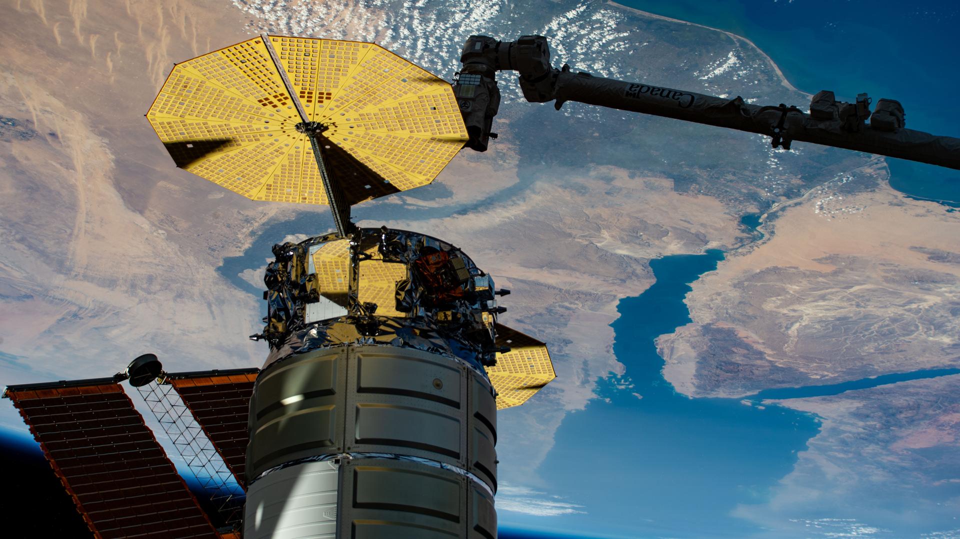 Northrop Grumman's Cygnus XL cargo craft is pictured installed to the Unity module's Earth-facing port as the International Space Station orbited 259 miles above the Mediterranean Sea. The Red Sea and Egypt's Nile Delta are viewed from the vantage point of an external high definition camera on the orbital outpost. Extending from the upper right, is the Canadarm2 robotic arm that had captured Cygnus after its arrival on Sept. 18, 2025.