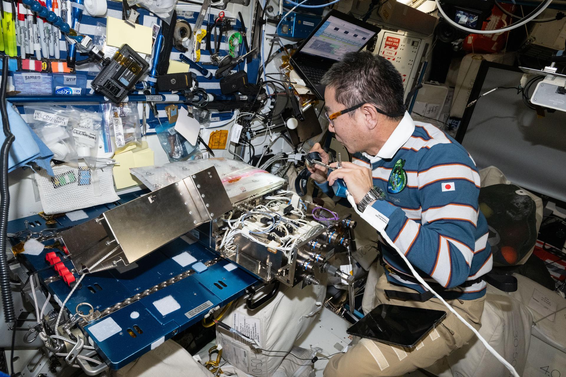 JAXA (Japan Aerospace Exploration Agency) astronaut and Expedition 73 Flight Engineer Kimiya Yui works on computer networking hardware inside the International Space Station's Harmony module. Yui was conducting ethernet hub upgrades to transmit data quicker and more efficiently throughout the orbital outpost.