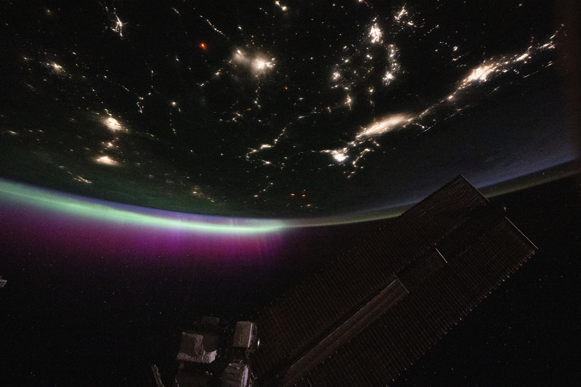 iss073e0780439 (Sept. 2, 2025) --- A diffuse aurora glows above Earth's horizon over Canada as its red and green hues shimmer like neon lights—an effect created by excited oxygen atoms high in the atmosphere. The city lights of the U.S.-Canadian Pacific Northwest (toward upper right) trace the continent eastward. The red aurora is produced by high-altitude oxygen atoms (~300 km), while the green glow comes from lower-altitude oxygen (~100 km), both excited by energetic electrons guided into the atmosphere by Earth's magnetic field during solar activity.
