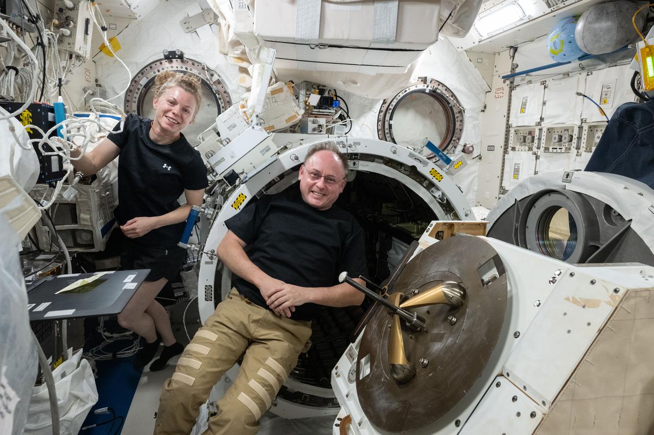 iss073e0813519 (Sept. 26, 2025) --- NASA astronauts Zena Cardman and Mike Fincke, both Expedtion 73 Flight Engineers, pose for a portrait inside the International Space Station's Kibo laboratory module during science hardware maintenance in Kibo's airlock.