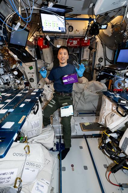 NASA astronaut Jonny Kim shows off Voyager DNA Decryption experiment hardware