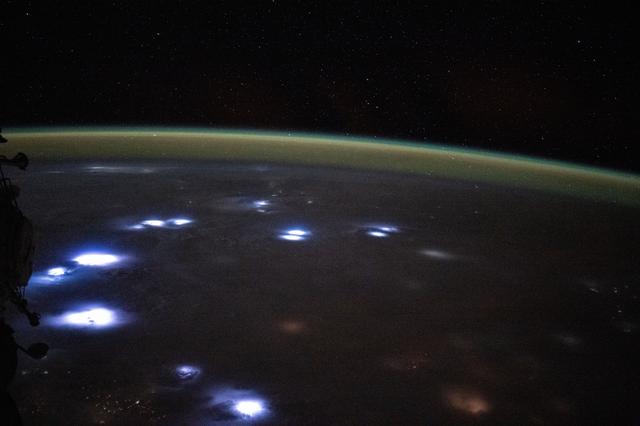 NASA image: Bright lightning storms illuminate the cloudy landscape of western Africa