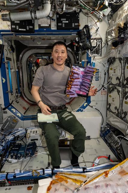 NASA image: NASA astronaut Jonny Kim shows off production bags for the BioNutrients-3 investigation