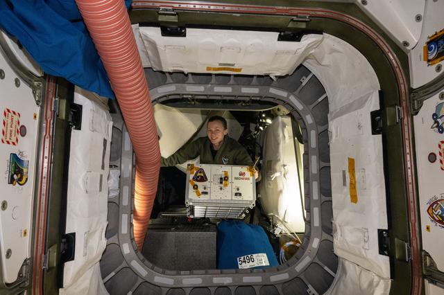 NASA image: NASA astronaut Zena Cardman transfers the Advanced Space Experiment Processor-2