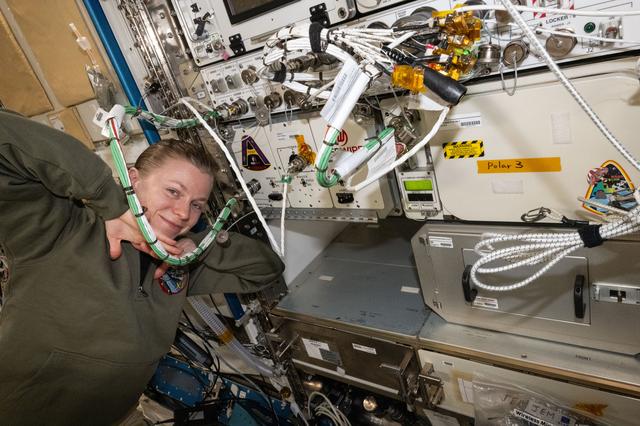 NASA image: NASA astronaut Zena Cardman displays the Advanced Space Experiment Processor-2