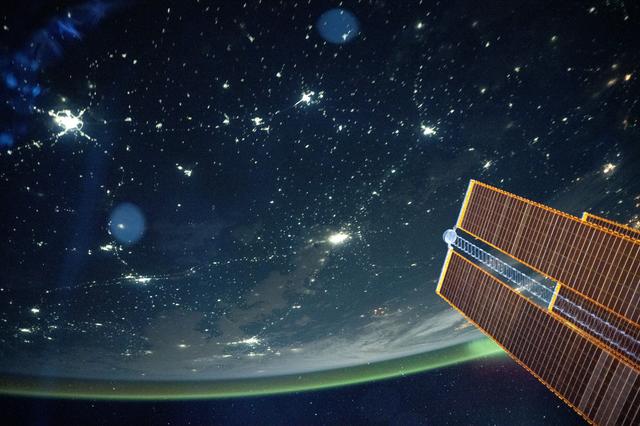 NASA image:  A tranquil, blue-green airglow blankets Earth's horizon above  Kazakhstan