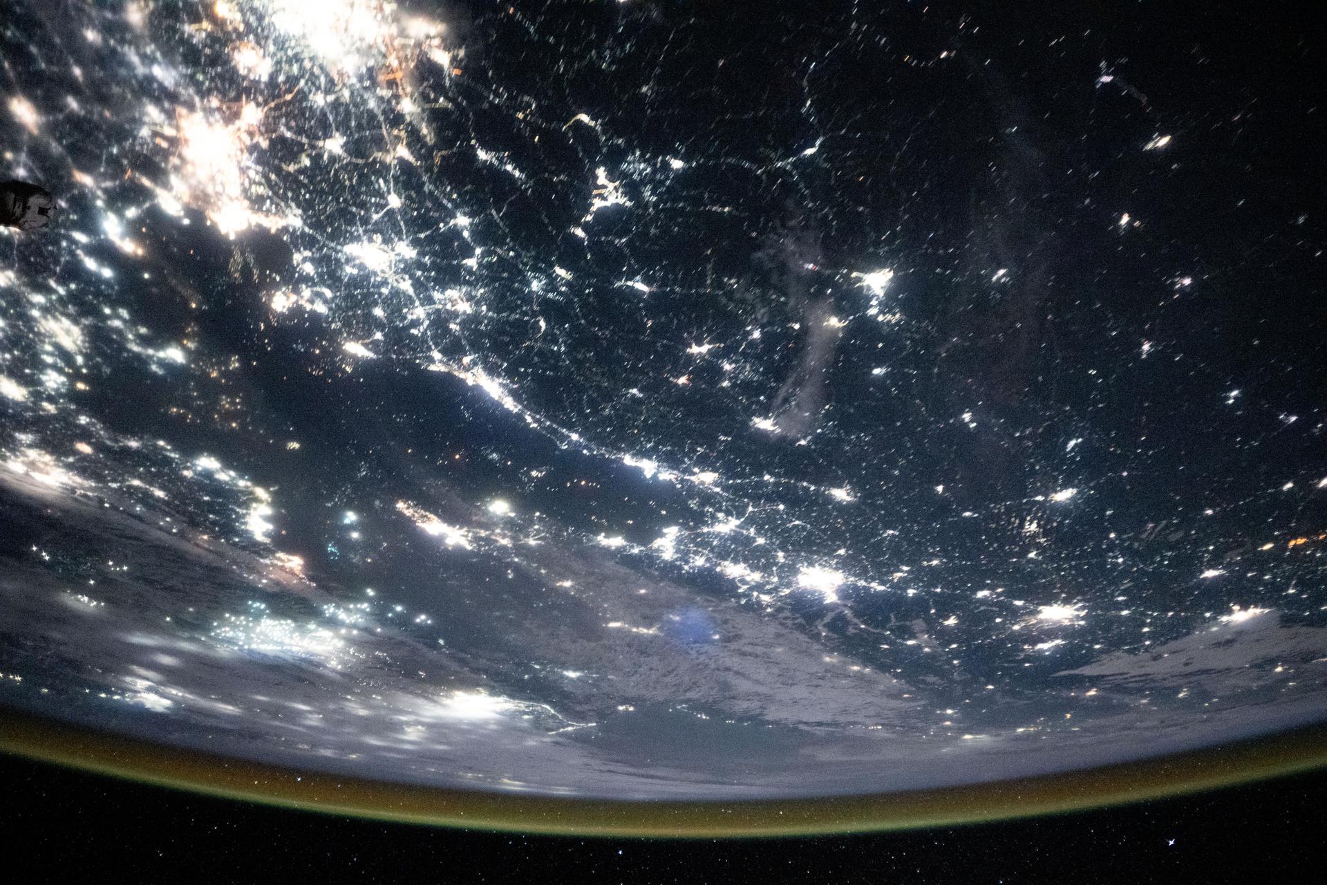The Korean Peninsula—highlighted by Seoul, South Korea (bottom left)—and Northeast China—illuminated by the Beijing Municipality (top left)—are pictured from the International Space Station as it orbited 262 miles above Asia at approximately 12:42 a.m. local time.