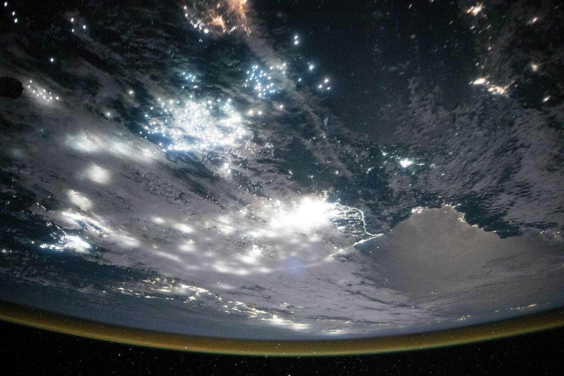 The well-lit border (center) between South Korea and the less-illuminated North Korea is framed by the moonlit Sea of Japan (bottom) and the Yellow Sea (top), which is dotted with the bright lights of fishing boats. These lights are used to attract nocturnal fish, including anchovies, mackerel, and squid. The International Space Station was orbiting 262 miles above the Bohai Sea at approximately 12:43 a.m. local time when this photograph was taken.