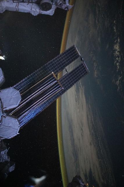 NASA image: A dim, yellow-green airglow crowns Earth’s horizon between northwestern Australia and Indonesia