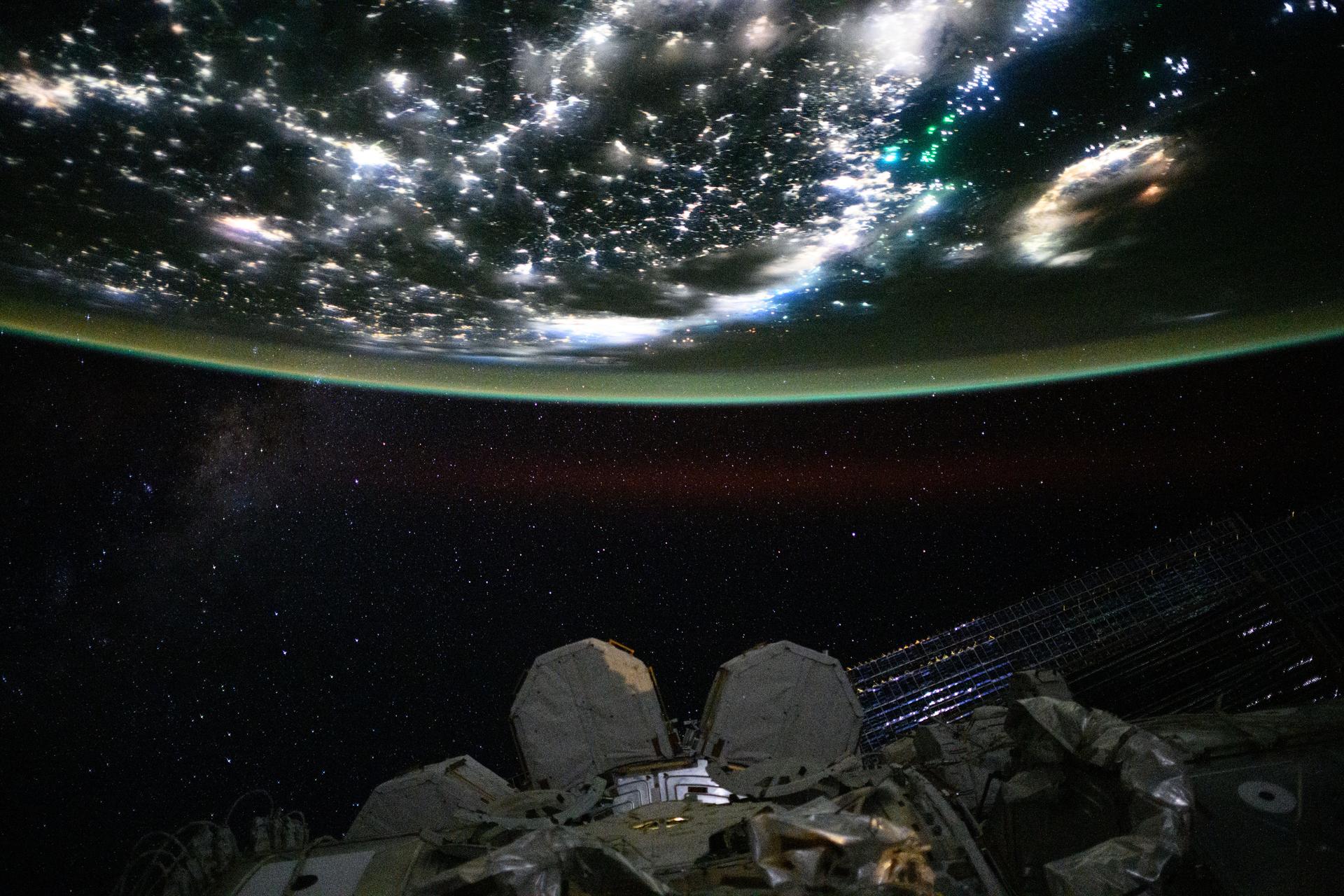 Green fishing boat lights lure squid, mackerel, and amberjack in the Taiwan Strait near China’s coast, glowing with white LED city lights from Fuzhou to Shenzhen. In contrast, Taiwan’s coast (right) from Taipei to Kaohsiung glows amber from sodium streetlights. The International Space Station captured this view from 261 miles above the East China Sea at 11:55 p.m. local time.