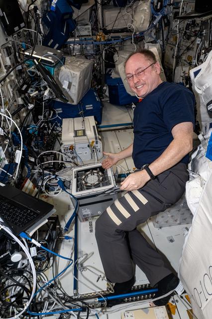 NASA image: NASA astronaut Mike Fincke works on a Kubik research incubator