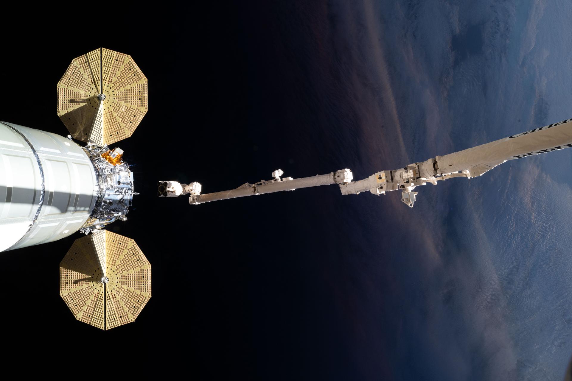 The Canadarm2 robotic arm releases Northrop Grumman’s Cygnus XL cargo craft after it was installed on the Earth-facing port of the Unity module. The International Space Station was soaring into an orbital sunrise 269 miles above the Atlantic Ocean southwest of Cape Town, South Africa, at the time of this photgraph.