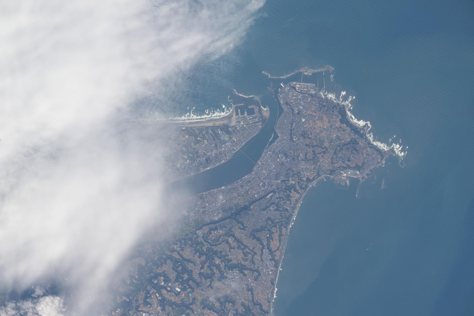 The Tone River flows through the northern part of Chōshi, Japan, a coastal city on the Pacific Ocean with a population of over 59,000. Chōshi, pictured here from the International Space Station as it orbited 261 miles above the Pacific, is known for the Inubosaki Lighthouse and as one of Japan’s top soy sauce producers