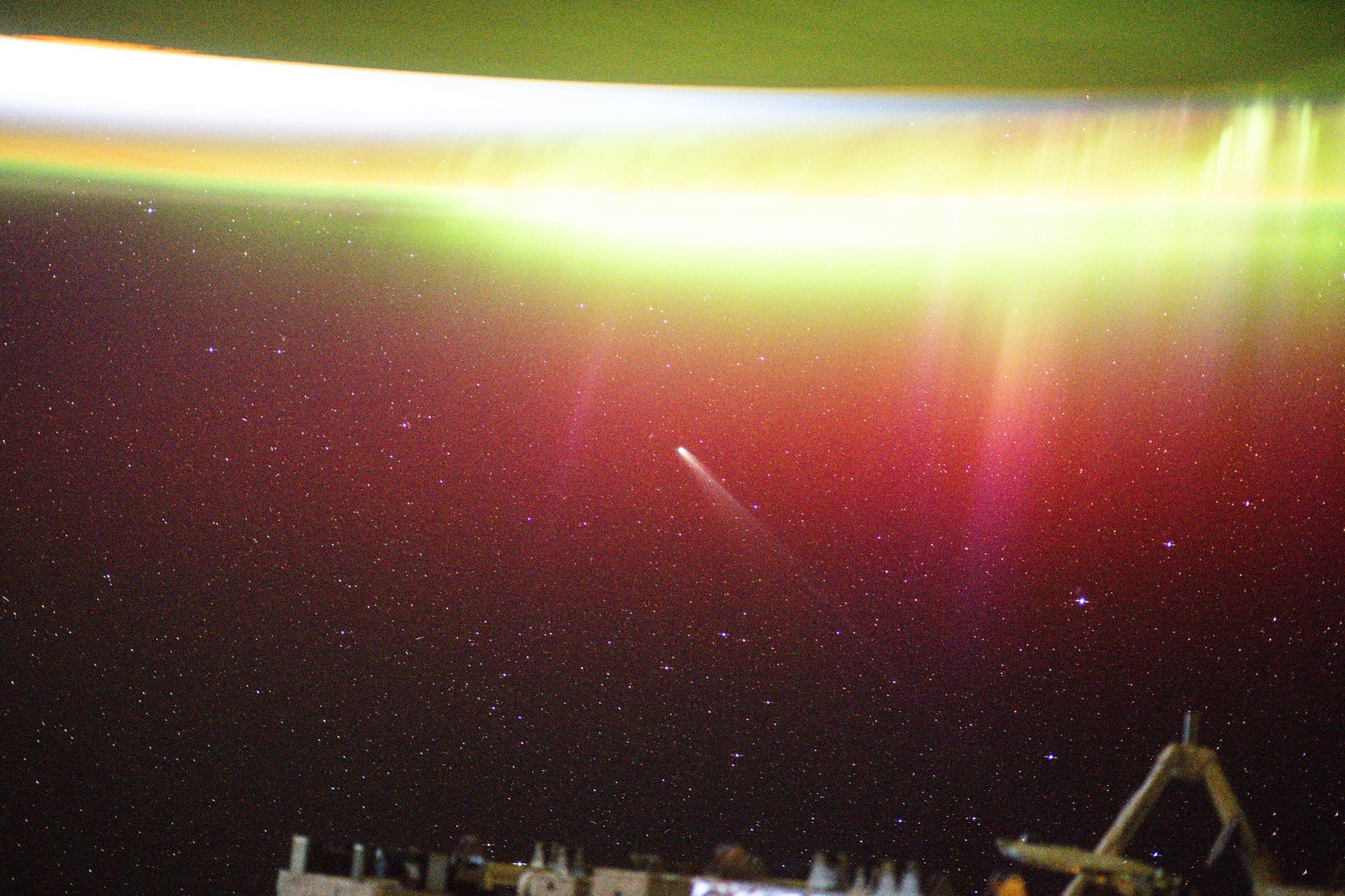 This long-exposure photograph shows a bright aurora radiating above Earth as Comet Lemmon (C/2025 A6) soared past the planet at a distance of about 57.2 million miles (92.1 million kilometers). The International Space Station was orbiting 263 miles above northern Minnesota at the time of this photograph.