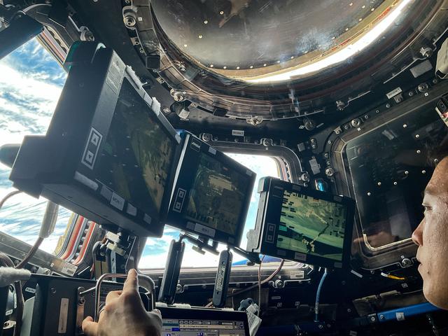 NASA image: NASA astronaut Jonny Kim practices Canadarm2 robotic maneuvers at the robotics workstation