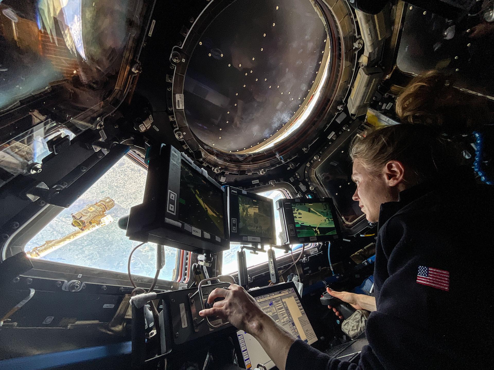 NASA astronaut and Expedition 73 Flight Engineer Zena Cardman practices Canadarm2 robotic maneuvers at the robotics workstation inside the International Space Station's cupola. Kim was preparing for the robotic capture of the Northrop Grumman Cygnus XL cargo spacecraft that launched on Sept. 14, 2025, and arrived on Sept. 18 delivering about 11,000 pounds of science, supplies, and hardware to the Expedition 73 crew.