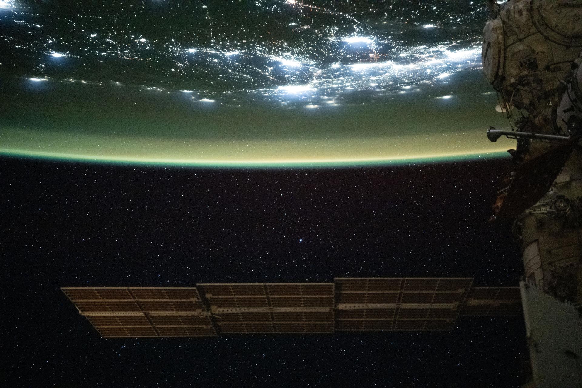 iss073e0982431 (Oct. 25, 2025) --- A yellow-green airglow, caused by atoms and molecules releasing energy as light after being excited by ultraviolet sunlight or cosmic rays, blankets the city lights of North America in this photograph, taken at approximately 2:18 a.m. local time from the International Space Station as it orbited 260 miles above Texas.