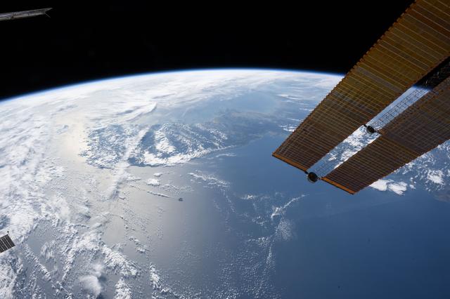 NASA image:  A partly cloudy Korean Peninsula surrounded by the Sea of Japan and the Yellow Sea
