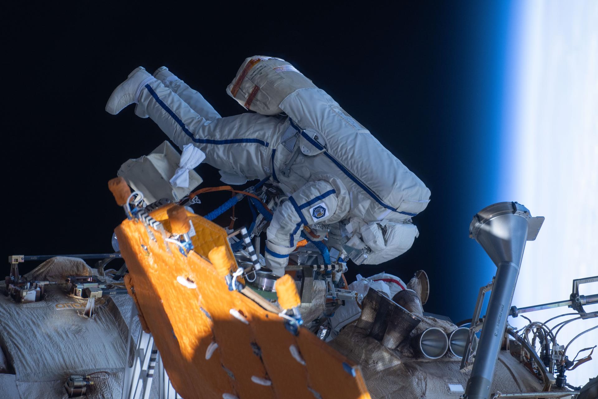 Roscosmos cosmonaut and Expedition 73 Flight Engineer Alexey Zubritsky is pictured in his Orlan spacesuit conducting a spacewalk 262 miles above Earth. During the spacewalk, Zubritsky installed a pulse plasma injector, cleaned a window on the Nauka science module, replaced a materials science cassette on Nauka, and moved a controller interface for the European robotic arm.