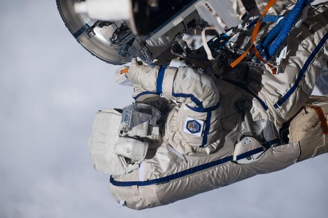 NASA image: Cosmonaut Alexey Zubritsky is pictured in his Orlan spacesuit conducting a spacewalk