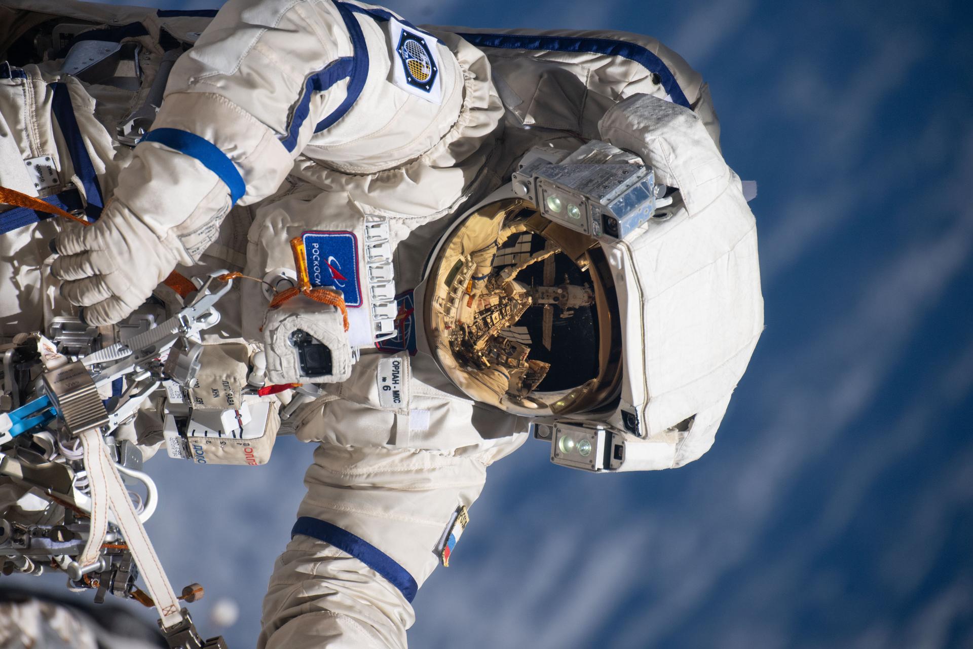 iss073e0988292 (Oct. 28, 2025) --- Roscosmos cosmonaut and Expedition 73 Flight Engineer Alexey Zubritsky is pictured in his Orlan spacesuit conducting a spacewalk 271 miles above Earth. During the the spacewalk, Zubritsky installed a pulse plasma injector, cleaned a window on the Nauka science module, replaced a materials science cassette on Nauka, and moved a controller interface for the European robotic arm.
