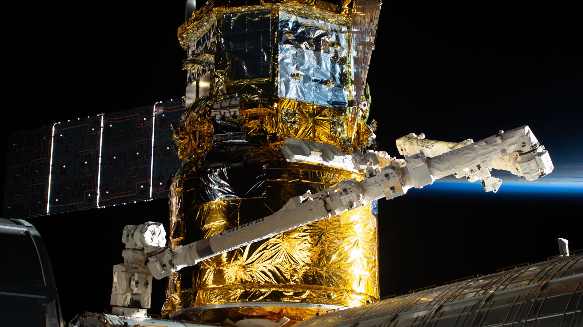 The HTV-X1 cargo spacecraft from JAXA (Japan Aerospace Exploration Agency) is pictured in the grips of the Canadarm2 robotic arm after it was berthed to the Harmony module's Earth-facing port on the International Space Station. HTV-X1 delivered about 12,800 pounds of science experiments, supplies, and hardware for the Expedition 73 crew, following its launch three days earlier from the Tanegashima Space Center in Japan.