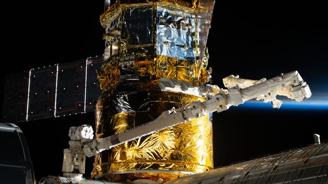 NASA image: The HTV-X1 cargo spacecraft is pictured berthed to the Harmony module