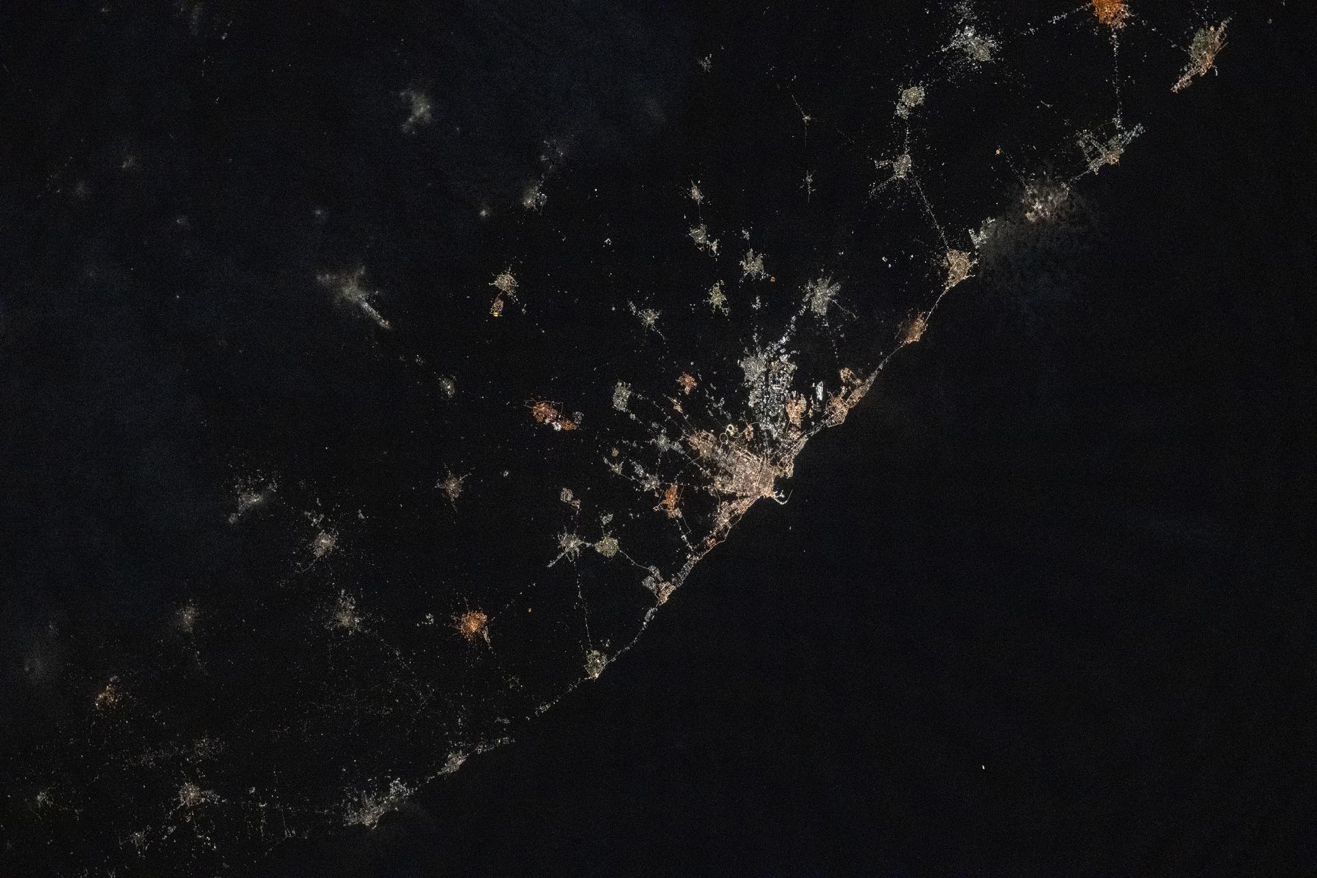 The city lights of Bari, Italy, and its surrounding suburbs dot the nation's Adriatic Sea coast in this photograph taken from the International Space Station at approximately 10:13 p.m. local time as it orbited 260 miles above the Mediterranean Sea. Founded around 2,700 years ago, Bari is known for its olive groves, vineyards, spectacular caves, and rugged coastal cliffs.