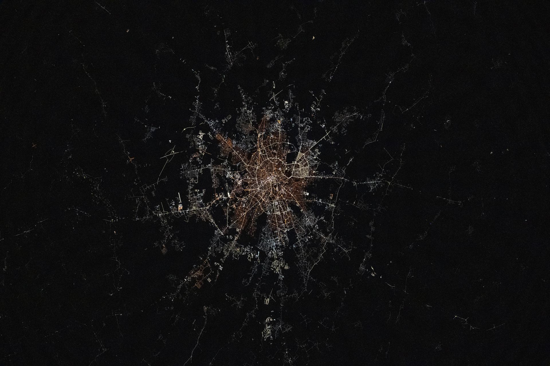 iss073e1047246 (Nov. 2, 2025) --- Bucharest, Romania—the nation's capital with a metropolitan population of about 1.78 million—transitions from older, amber-hued sodium-vapor lights in its city center to modern, white cooler LED lighting in its outskirts and suburbs. This photograph was taken from the International Space Station as it orbited 261 miles above Eastern Europe at approximately 11:15 p.m. local time.