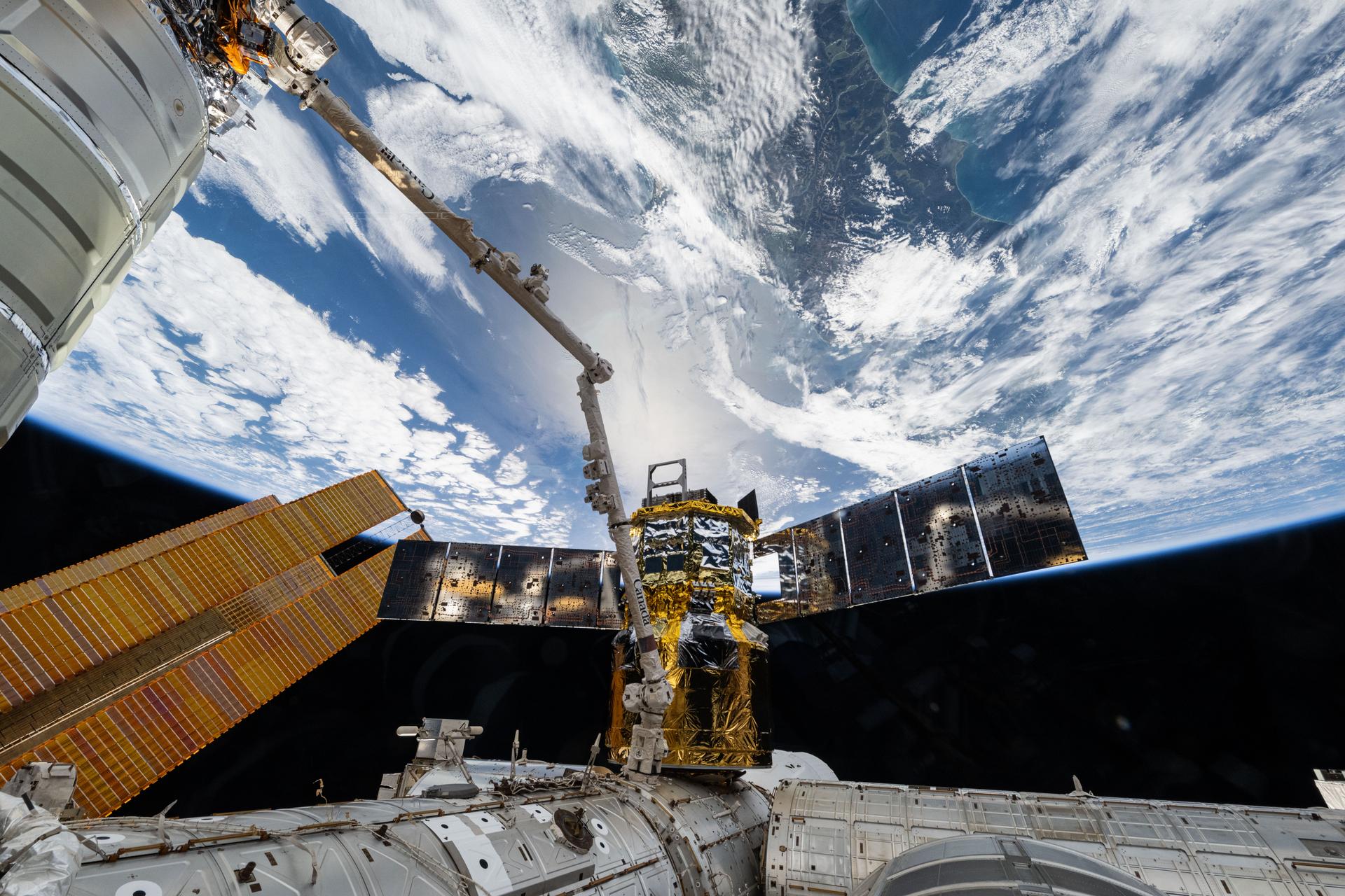 The HTV-X1 cargo spacecraft from JAXA (Japan Aerospace Exploration Agency) is pictured attached to the Earth-facing port on the Harmony module while in the grips of the Canadarm2 robotic arm. The International Space Station was orbiting 271 miles above New Zealand at the time of this photograph.