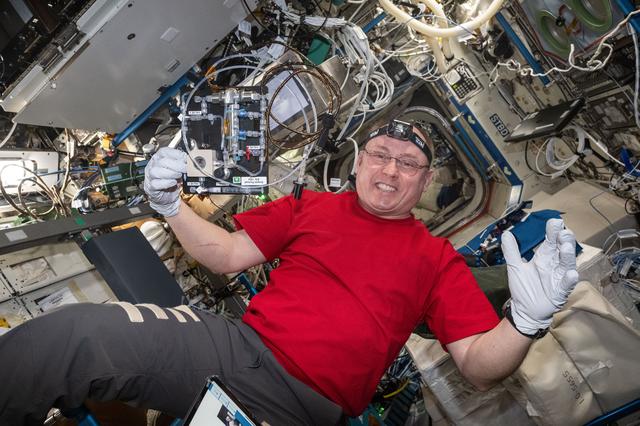 NASA image: NASA astronaut Mike Fincke smiles works on the Droplets fluid physics investigation