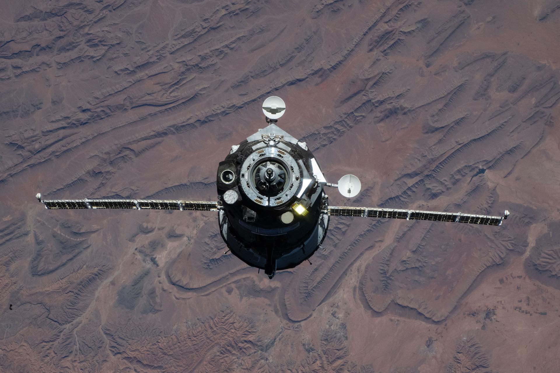 The Soyuz MS-28 crew spacecraft carrying NASA astronaut Chris Williams and Roscosmos cosmonauts Sergey Kud-Sverchkov and Sergei Mikaev approaches the International Space Station. Both spacecraft were orbiting 263 miles above the mountainous region in southern Morocco at the time of this photograph.