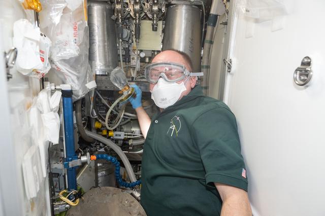 NASA image: NASA astronaut Mike Fincke wears personal protective equipment inside the Tranquility module