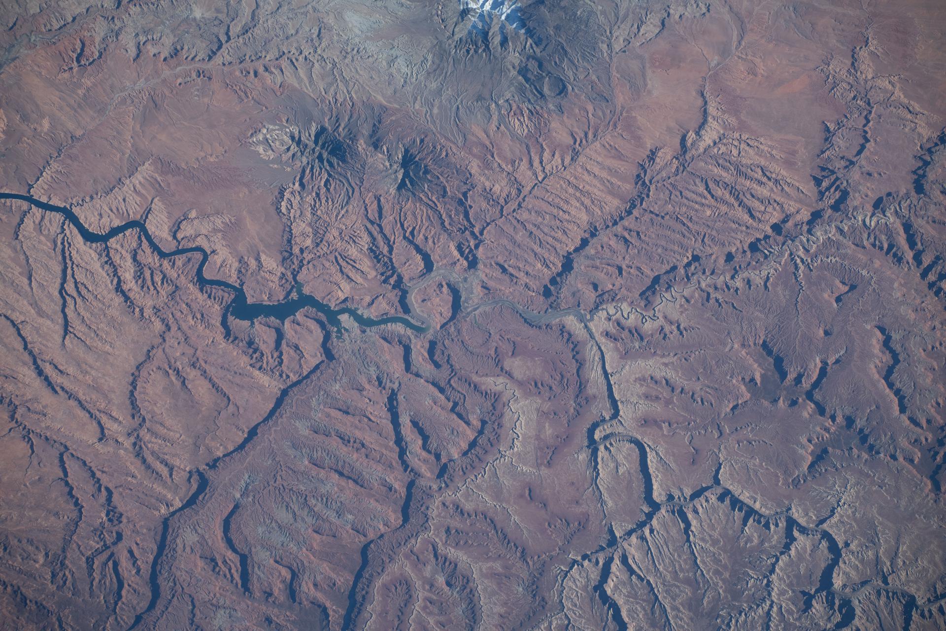 Glen Canyon National Recreation Area in Utah—featuring Lake Powell, Good Hope Rock, and Mt. Pennell (top), popular spots for sightseeing, fishing, and hiking—is pictured from the International Space Station as it orbited 262 miles above North America.