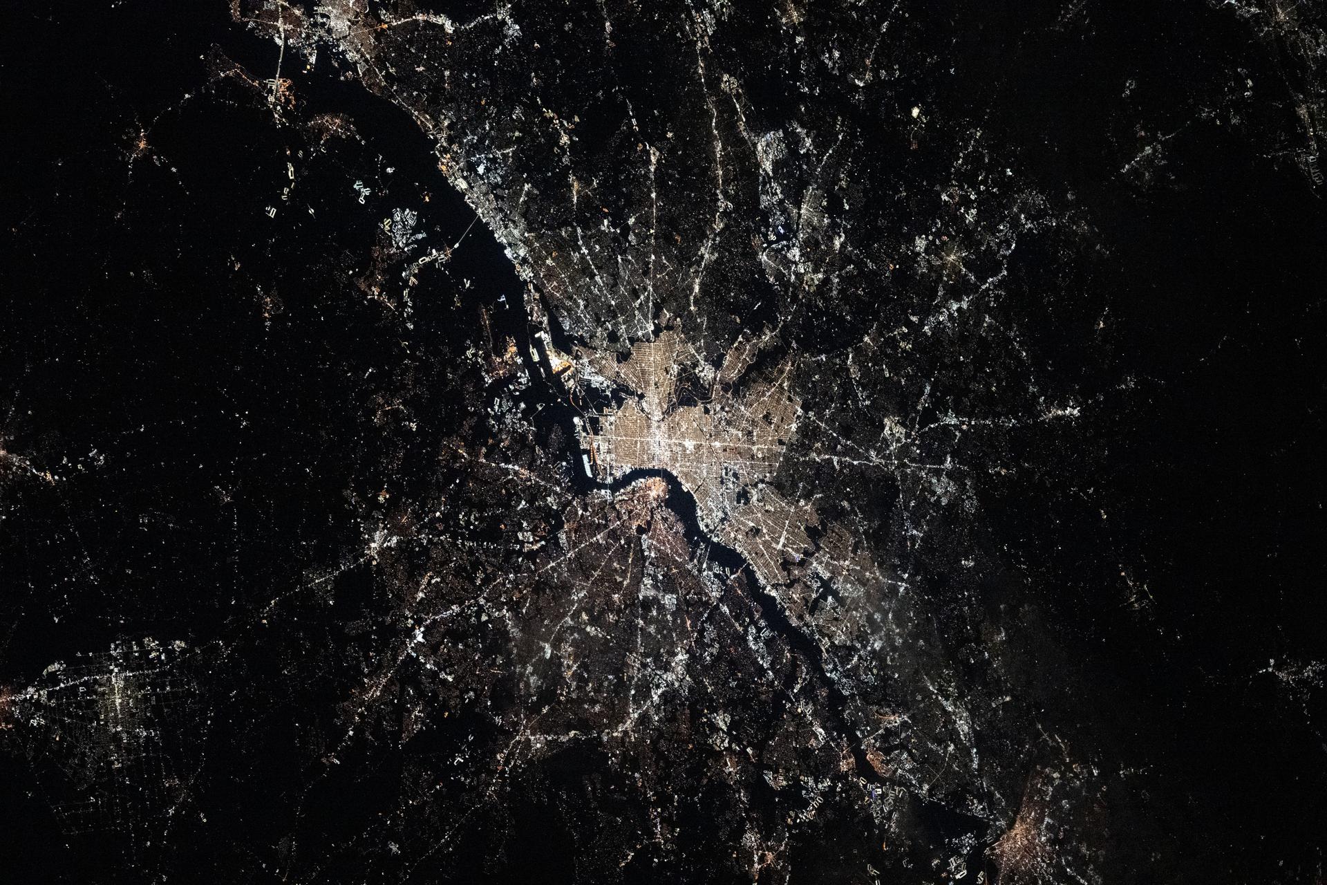 Philadelphia, Pennsylvania—the United States’ first capital and the city where the Declaration of Independence was signed, with a population of about 1.74 million—sits along the Delaware River, with New Jersey on the opposite bank. This photograph was taken at approximately 3:28 a.m. local time from the International Space Station as it orbited 262 miles above the Atlantic coast.