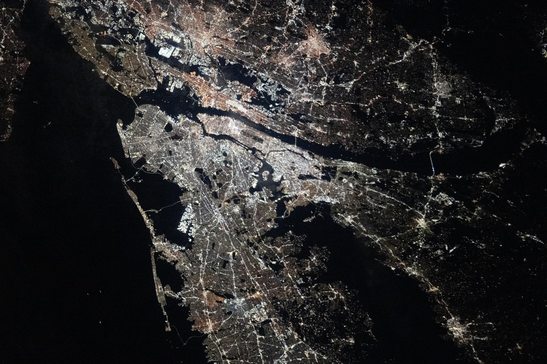 The New York–Newark–Jersey City Metropolitan Statistical Area, which spans 23 counties across New York, New Jersey, and Connecticut and has a population of about 19.9 million, is pictured at approximately 3:29 a.m. local time from the International Space Station as it orbited 262 miles above the Atlantic coast.