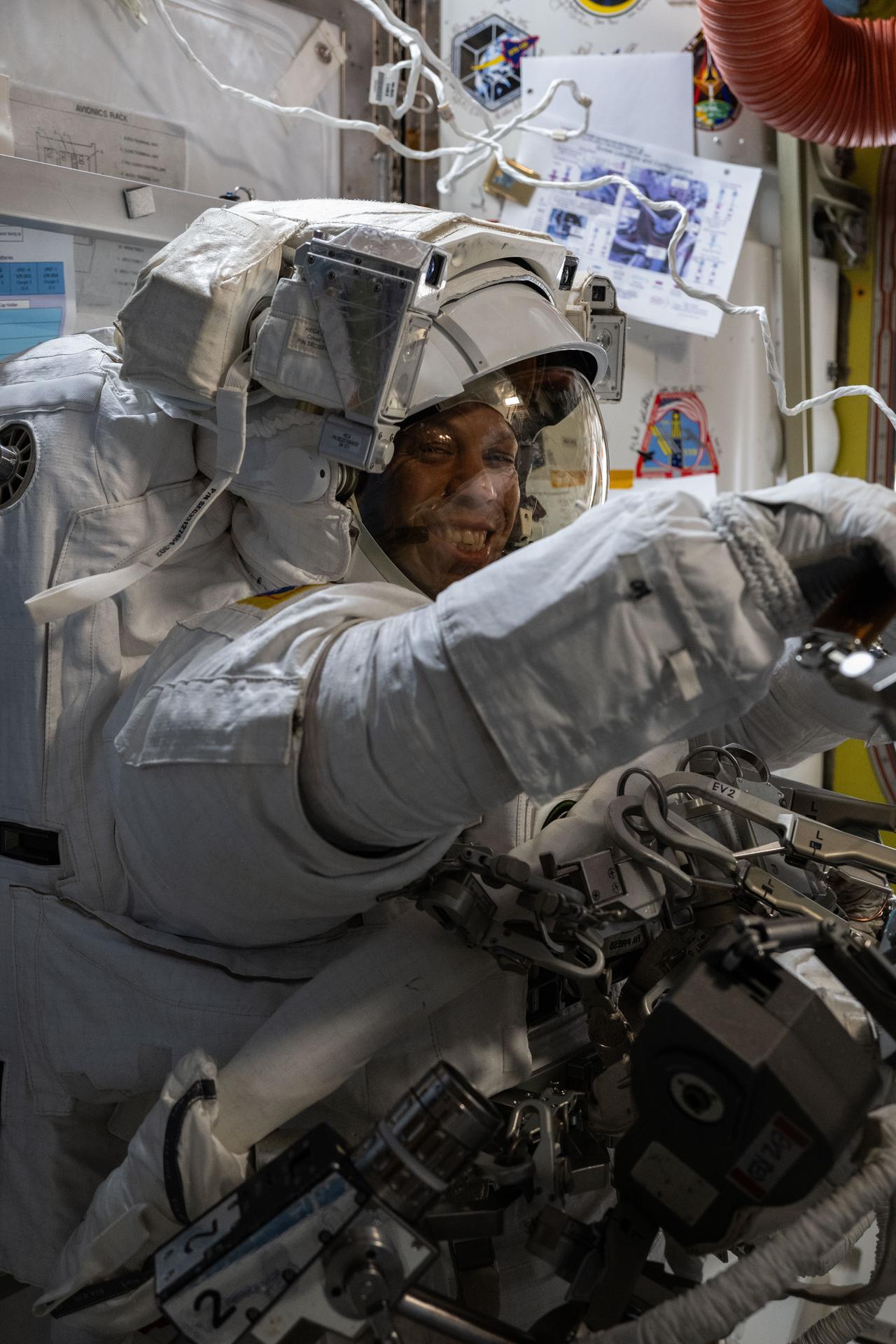 NASA astronaut and Expedition 74 crew member Chris Williams smiles for the camera during a spacesuit fit verification inside the International Space Station’s Quest airlock. Officially called the On-Orbit Fit Verification, this procedure confirms that the spacesuit is airtight and properly configured, assesses comfort and mobility, and helps prevent potential safety risks.